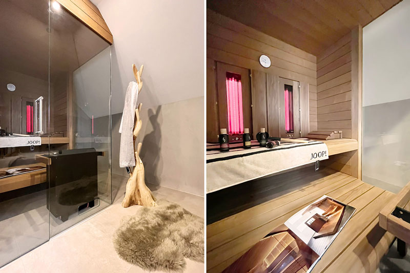 Private Sauna mit Glasfront, warmem Holzinterieur und stimmungsvoller Infrarotbeleuchtung im Wellnessbad.